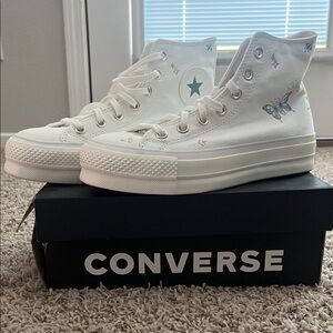 Converse Women's White High-Tops with Blue Accents